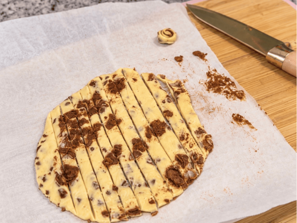 Rolled out cinnamon rolls for gingerbread bars